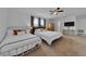 A spacious bedroom with multiple beds, dark curtains, and modern decor for comfortable living at 2210 Derwent Dr, Davenport, FL 33896