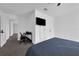 This bedroom features a comfortable bed, a television, and dedicated workspace at 2210 Derwent Dr, Davenport, FL 33896