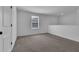 Bonus room or loft area with plush carpeting, a bright window, and an airy feel at 2210 Derwent Dr, Davenport, FL 33896