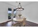 A bright dining area boasts access to the outdoors, allowing for a seamless transition to outdoor living at 2210 Derwent Dr, Davenport, FL 33896