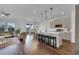 Open floor plan featuring a living room, kitchen with island, and a dining area at 2210 Derwent Dr, Davenport, FL 33896