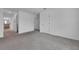 Open living space with neutral walls, plush carpeting, and connections to other rooms in the house at 2210 Derwent Dr, Davenport, FL 33896