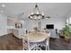 This open-concept design seamlessly connects the kitchen, dining, and living areas, creating a spacious and inviting atmosphere at 2210 Derwent Dr, Davenport, FL 33896