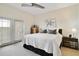 Bright bedroom featuring a ceiling fan, neutral colors, and a sliding glass door to a balcony at 2305 Edgewater Dr # 1613, Orlando, FL 32804
