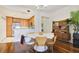 Stylish dining room with modern furniture, a round table, and an open view to the kitchen at 2305 Edgewater Dr # 1613, Orlando, FL 32804