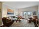 Spacious living room featuring modern furnishings, a plush rug, and bright natural light at 2305 Edgewater Dr # 1613, Orlando, FL 32804