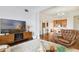 Open-concept living area featuring hardwood floors, comfortable seating, and a bright and airy atmosphere at 2305 Edgewater Dr # 1613, Orlando, FL 32804