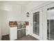 Outdoor patio featuring a built-in gas grill, granite countertop, and double doors to the interior at 2305 Edgewater Dr # 1613, Orlando, FL 32804