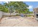 Spacious backyard featuring a basketball hoop, play set, trampoline, and patio furniture perfect for outdoor entertaining at 2312 Poinciana Rd, Winter Park, FL 32792