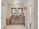 Bathroom features double sink vanity, granite counters, and access to a separate toilet and shower area at 2312 Poinciana Rd, Winter Park, FL 32792