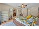 Bright bedroom with hardwood floors, decorated with a large bed and a view into other rooms at 2312 Poinciana Rd, Winter Park, FL 32792