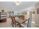 Open floor plan with dining area and views into the kitchen and living room at 2312 Poinciana Rd, Winter Park, FL 32792
