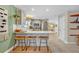Modern kitchen featuring stainless steel appliances, a breakfast bar with seating, and updated countertops at 2312 Poinciana Rd, Winter Park, FL 32792