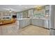 Bright kitchen with stainless steel appliances, lots of storage, bar-height seating, and an open floorplan at 2312 Poinciana Rd, Winter Park, FL 32792