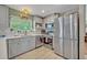 Up-to-date kitchen featuring stainless steel appliances, stylish tiled backsplash, and modern cabinets at 2312 Poinciana Rd, Winter Park, FL 32792