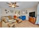 Cozy living room featuring a comfortable leather sectional and stylish decor accents at 2312 Poinciana Rd, Winter Park, FL 32792