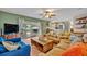 Open-concept living area with sliding glass doors to the patio and view of the kitchen at 2312 Poinciana Rd, Winter Park, FL 32792