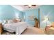 Airy bedroom featuring light blue walls, a plush bed, and a world map, creating a serene and inviting atmosphere at 287 Hilltop Dr, Longwood, FL 32750
