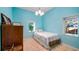 Cozy bedroom with natural light and peaceful ambiance, perfect for relaxation at 287 Hilltop Dr, Longwood, FL 32750