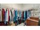 Spacious walk-in closet with custom shelving and ample storage for clothes and accessories at 287 Hilltop Dr, Longwood, FL 32750