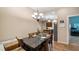 Inviting dining area connects seamlessly with the kitchen, featuring modern lighting and ample space for gatherings and entertaining at 287 Hilltop Dr, Longwood, FL 32750