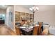Elegant dining room featuring a stylish table setting, custom shelving, and natural light perfect for entertaining guests at 287 Hilltop Dr, Longwood, FL 32750