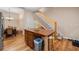 A kitchen island provides seating, storage, and workspace, conveniently near the dining area and staircase at 287 Hilltop Dr, Longwood, FL 32750
