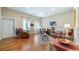 Inviting living room featuring gleaming hardwood floors, plush furnishings, and soft, natural light creating a relaxing atmosphere at 287 Hilltop Dr, Longwood, FL 32750
