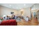 Bright living room boasts hardwood floors, cozy leather furniture, and stylish decor creating a welcoming atmosphere at 287 Hilltop Dr, Longwood, FL 32750
