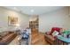 Spacious living room with hardwood floors, comfortable seating, and stylish accents creating an inviting gathering space at 287 Hilltop Dr, Longwood, FL 32750