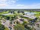 Aerial view showcasing the golf course and clubhouse with surrounding lush greenery and community at 2926 Claremont Ct # Ge, Orlando, FL 32822