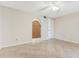 This bedroom features an arched doorway and tile flooring at 2926 Claremont Ct # Ge, Orlando, FL 32822