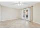 Light-filled bedroom with tile floors and private access to an outdoor area through French doors at 2926 Claremont Ct # Ge, Orlando, FL 32822