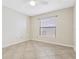 This bedroom offers a neutral color palette and tile flooring at 2926 Claremont Ct # Ge, Orlando, FL 32822