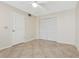 This bedroom offers ample closet space and neutral walls at 2926 Claremont Ct # Ge, Orlando, FL 32822