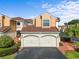 Inviting townhouse with a two-car garage, well-maintained landscaping, and classic architectural details under a bright sky at 2926 Claremont Ct # Ge, Orlando, FL 32822