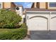 Charming townhome featuring a garage, arched entryway, and well-maintained landscaping at 2926 Claremont Ct # Ge, Orlando, FL 32822