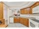 This spacious kitchen with oak cabinets opens to the living room at 2926 Claremont Ct # Ge, Orlando, FL 32822