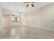 Open-concept living room featuring tile floors and a view of the kitchen at 2926 Claremont Ct # Ge, Orlando, FL 32822