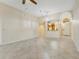 Spacious living area showcasing tile flooring, natural light, and a kitchen view at 2926 Claremont Ct # Ge, Orlando, FL 32822