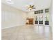 Bright living room featuring tiled floors, a fireplace, and double doors to the patio at 2926 Claremont Ct # Ge, Orlando, FL 32822