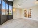 The enclosed patio features tile flooring, a ceiling fan, and access to the interior through double doors at 2926 Claremont Ct # Ge, Orlando, FL 32822