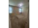 A vacant bedroom with carpeted floors, two windows, and neutral wall color offers a blank canvas for customization at 2983 Boating Blvd, Kissimmee, FL 34746