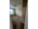A vacant bedroom with carpeted floors, one window, and neutral wall color offers a blank canvas for customization at 2983 Boating Blvd, Kissimmee, FL 34746