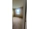 A vacant bedroom with carpeted floors, one window, and neutral wall color offers a blank canvas for customization at 2983 Boating Blvd, Kissimmee, FL 34746