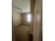 A vacant bedroom with carpeted floors, one window, and neutral wall color offers a blank canvas for customization at 2983 Boating Blvd, Kissimmee, FL 34746