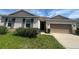 Charming single-story home featuring a two-car garage, and low-maintenance landscaping at 2983 Boating Blvd, Kissimmee, FL 34746