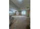 Open-concept living room with carpeted floors and bright natural light at 2983 Boating Blvd, Kissimmee, FL 34746