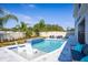 Modern backyard featuring a beautiful in-ground pool, spa, comfortable outdoor furniture, and meticulous landscaping at 3126 Wolf Lake Ave, Apopka, FL 32712