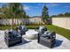 A well-maintained backyard featuring comfortable outdoor lounge furniture and a lush lawn, creating a perfect space for outdoor enjoyment at 3126 Wolf Lake Ave, Apopka, FL 32712